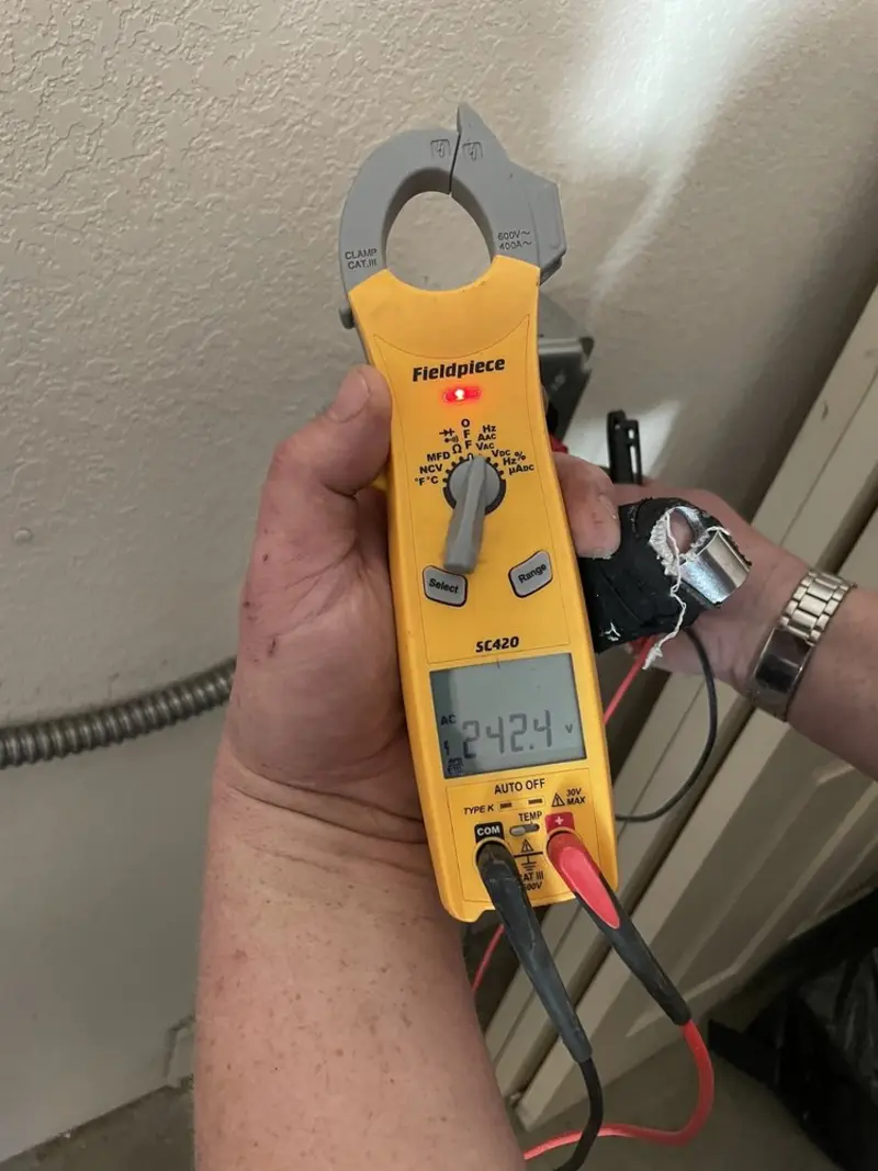 Voltage testing with clamp meter during Electrical Installation Services in Vandenberg AFB